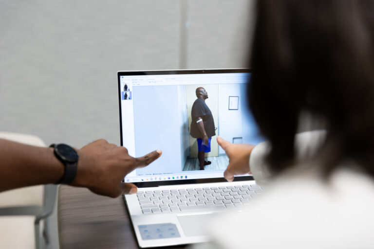 A surgeon and patient discuss surgical weight loss in Austin.