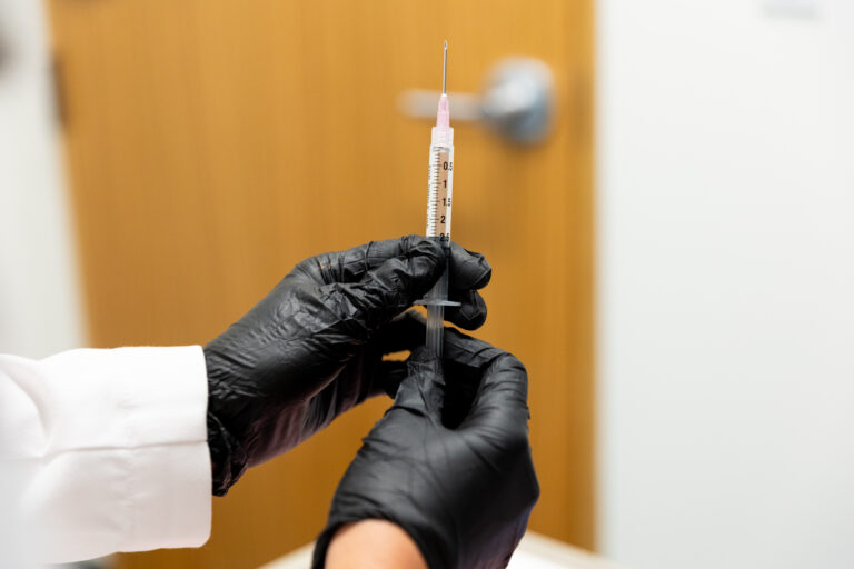 Provider holding lip filler near Round Rock