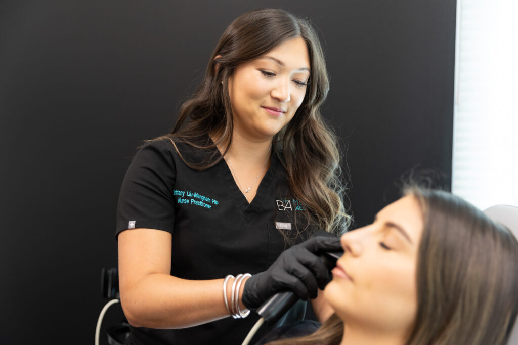 A woman performs Microneedling near Round Rock